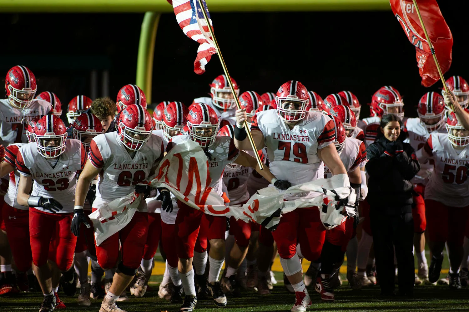 Lancaster running onto the field