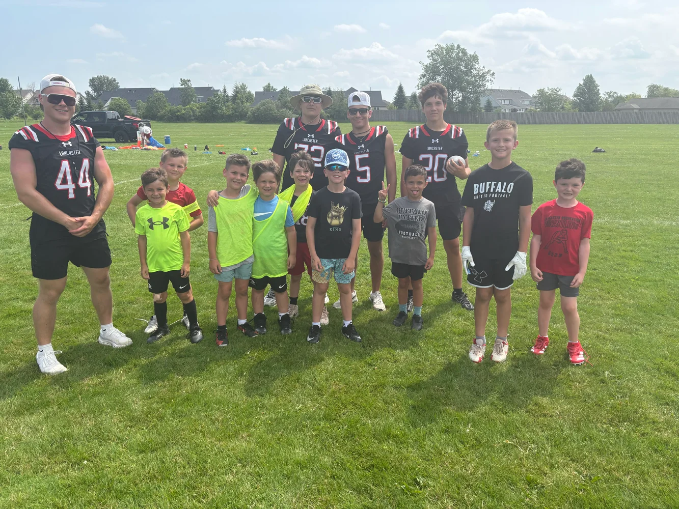 Camper and Players posing for the camera at the Lancaster Football Camp 2026