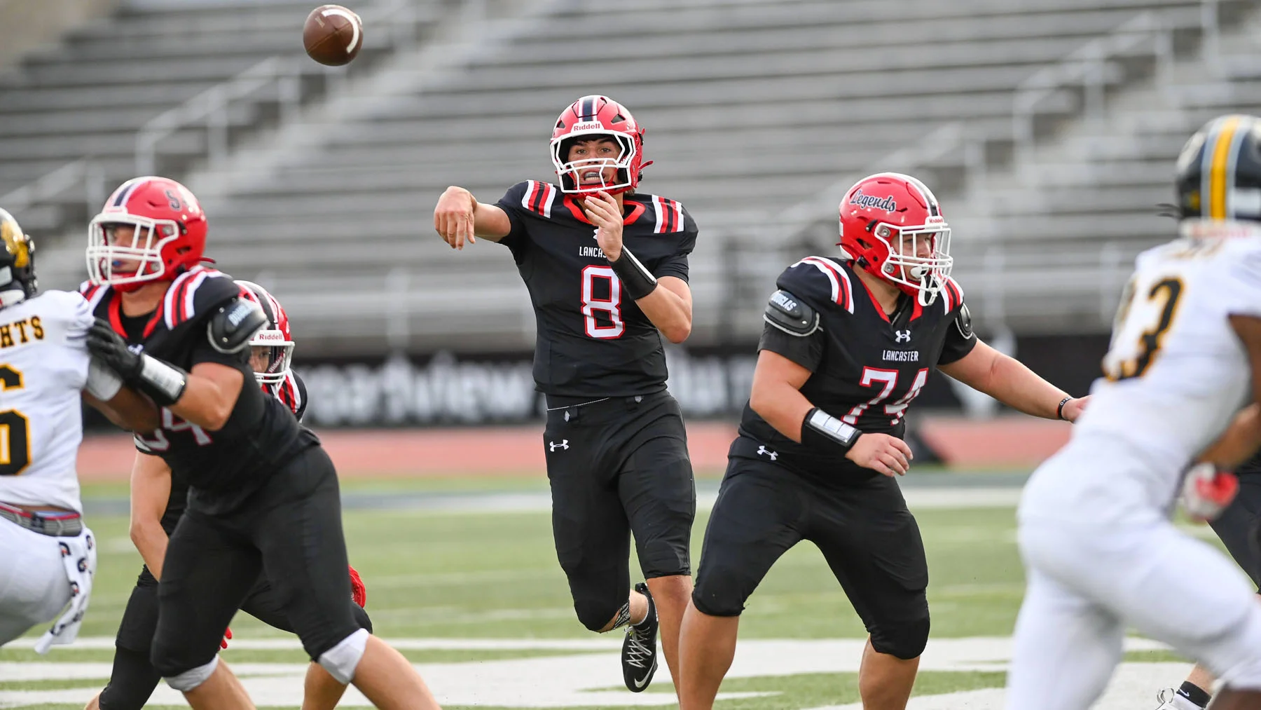 Lancaster QB throwing down field