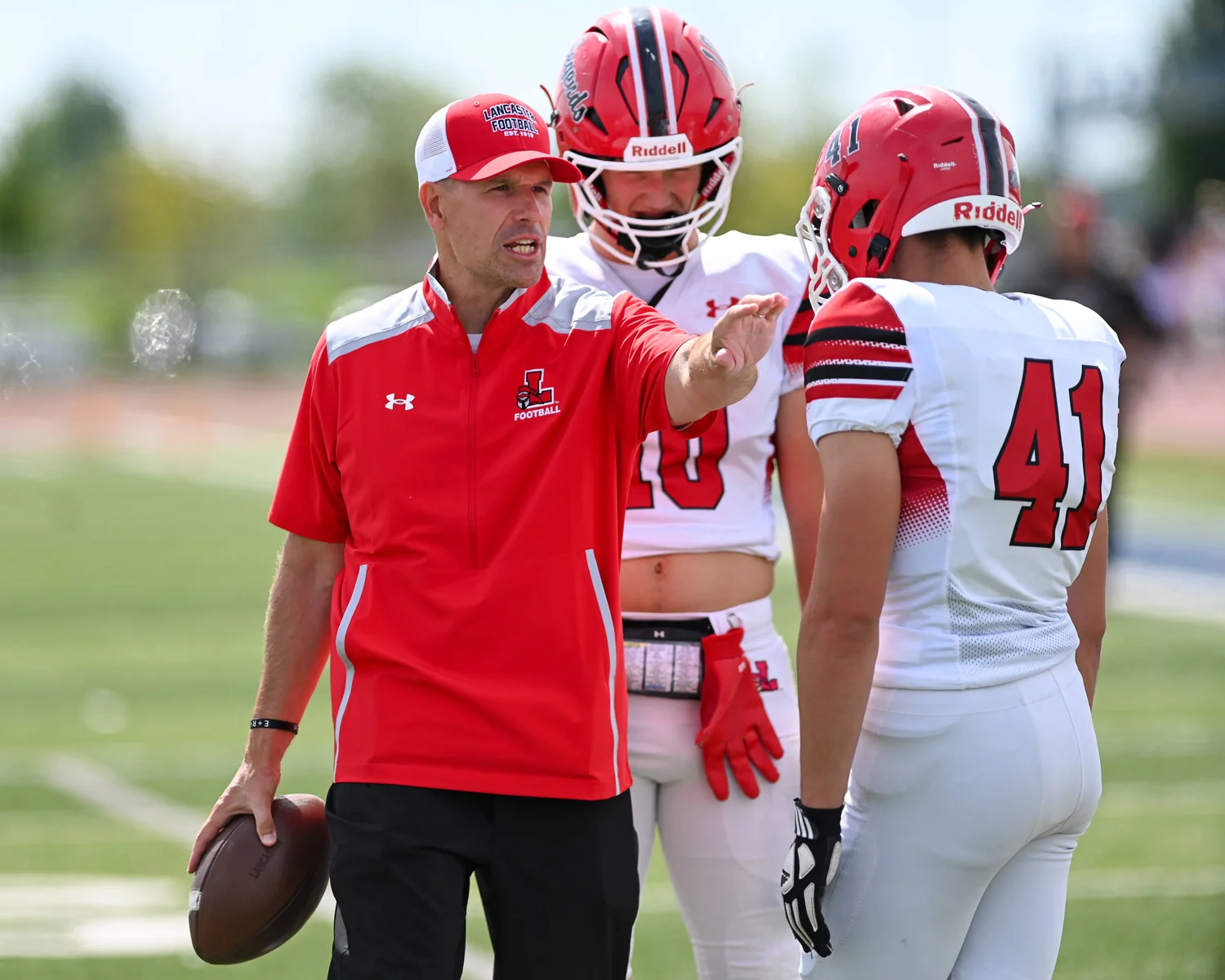 Coach talking to the players in pregame